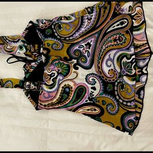 Wear alone or under a blazer or jean jacket.